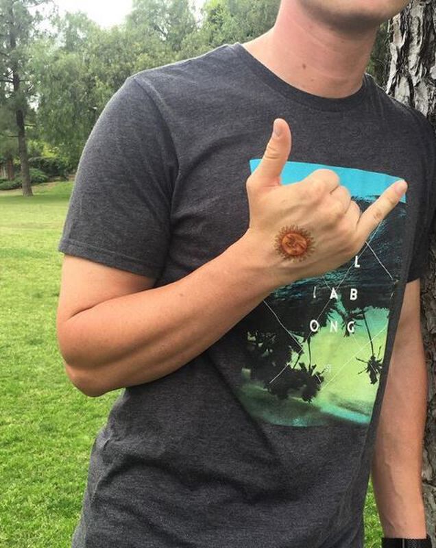 Collection of Smiling Sun Temporary Tattoo in a gallery layout